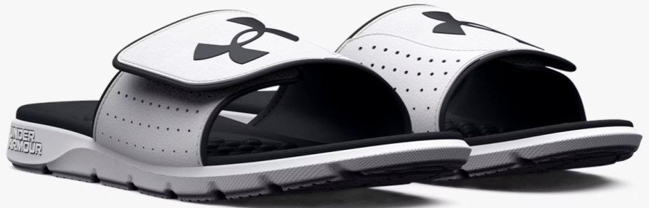 pair of light grey and black under armour slides