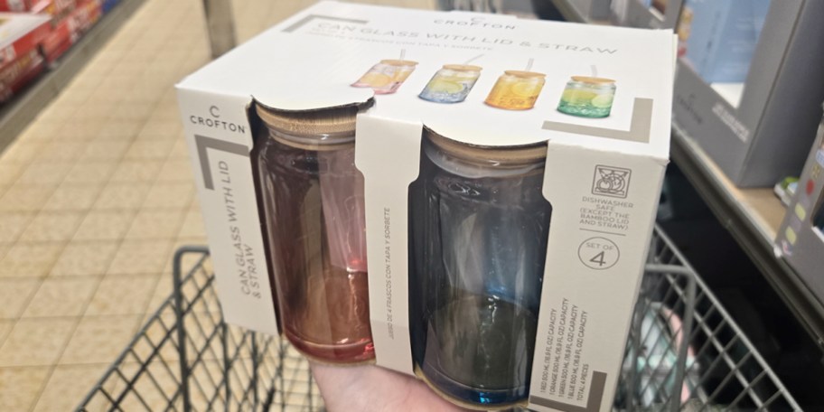 hand holding 4 pack of glass jar set 