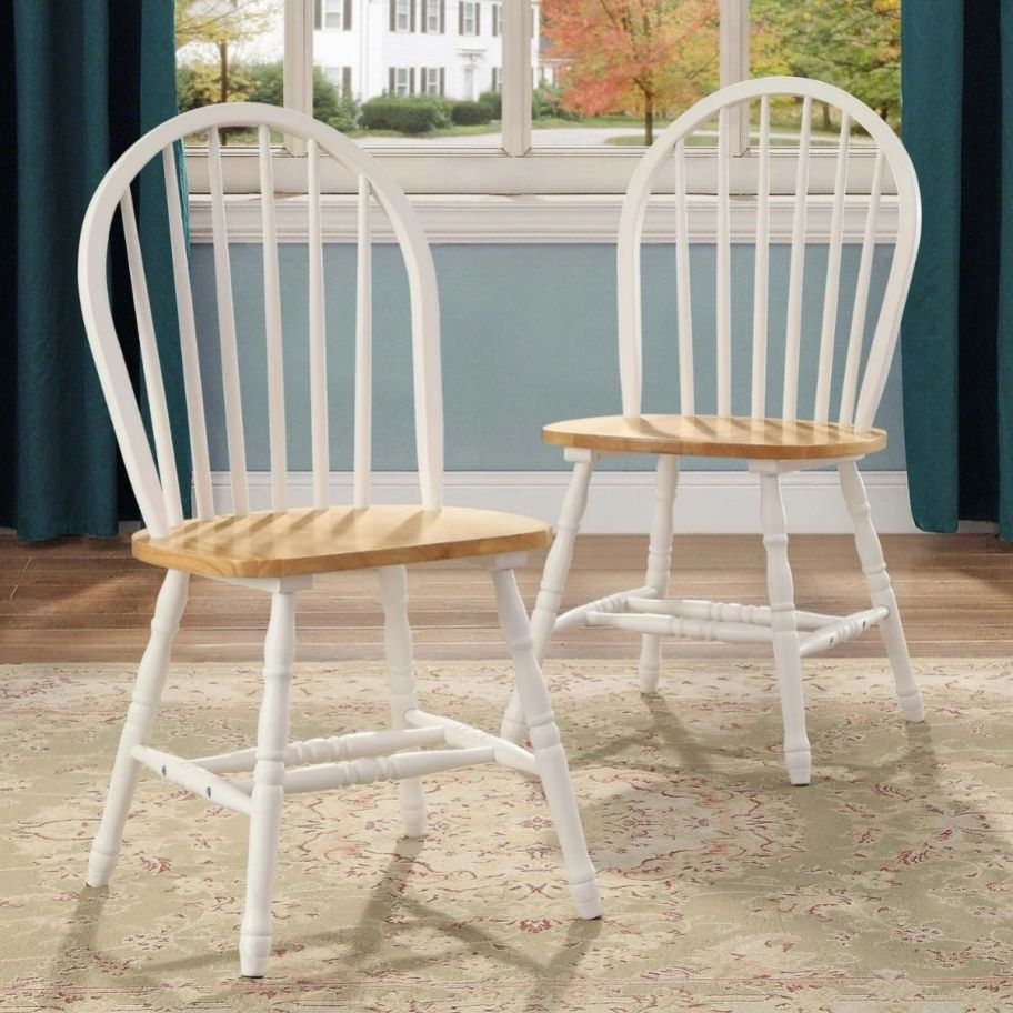 two white and naturla wood colored dining chairs